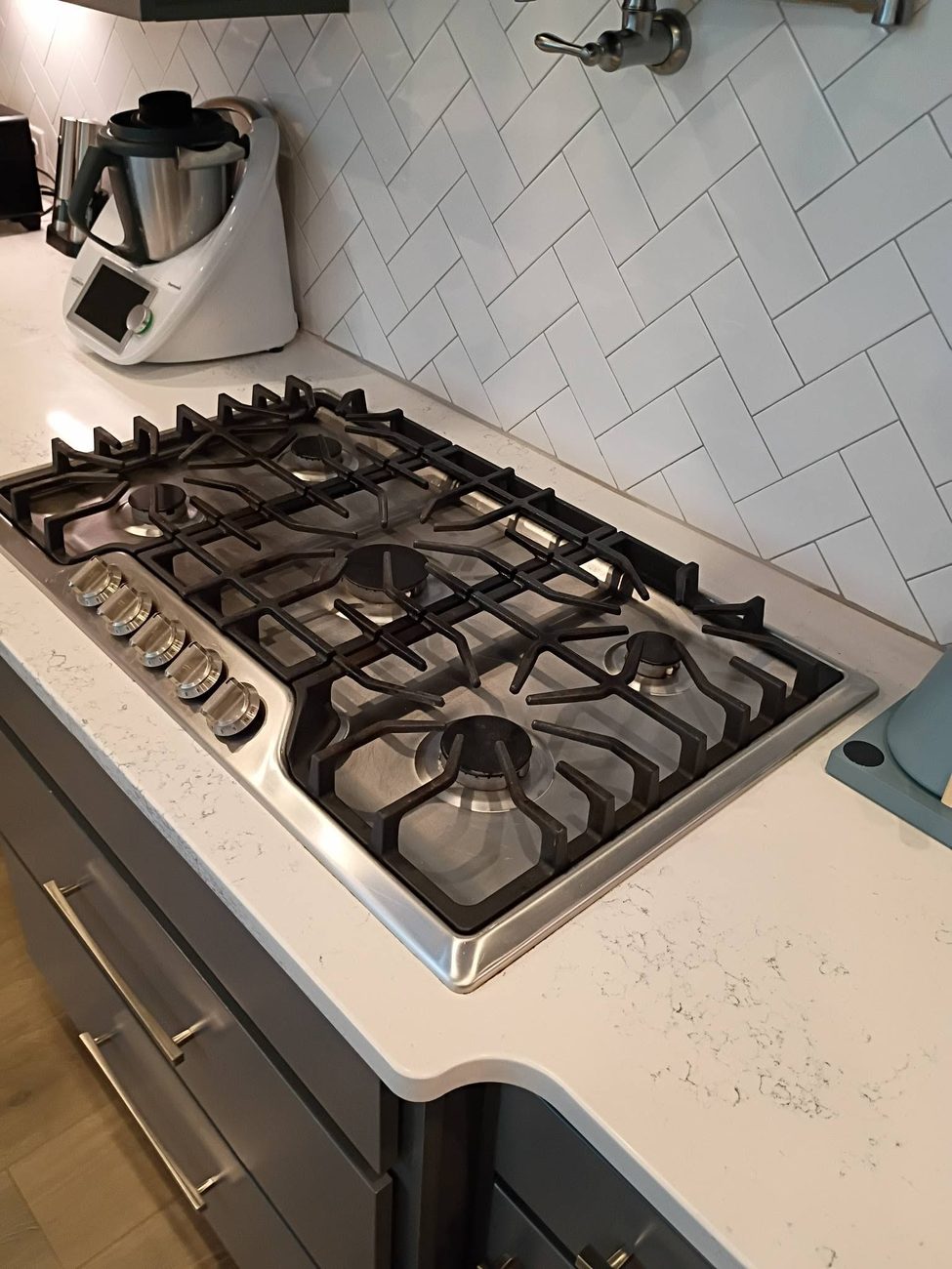 A gas cooktop cleaned down to the burners